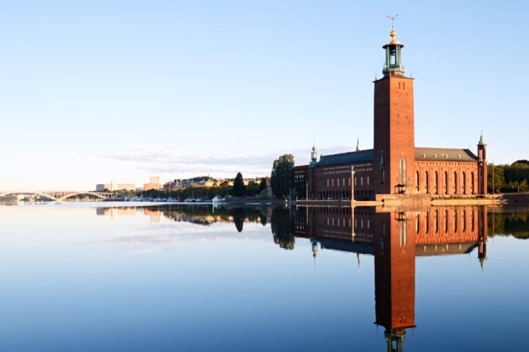 Stockholm City Hall reflecting on calm water