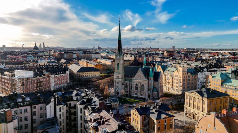 Aerial view of Stockholm's historic cityscape with a church.