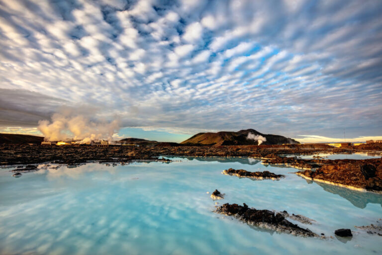 Blue Lagoon geothermal spa in Iceland with steam and cloudy sky