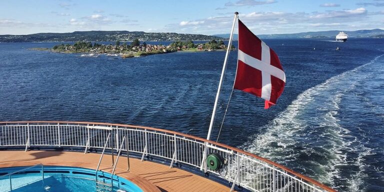View from cruise ship with Danish flag sailing between Copenhagen and Oslo.