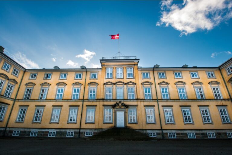 Frederiksberg Palace with Danish flag in Copenhagen