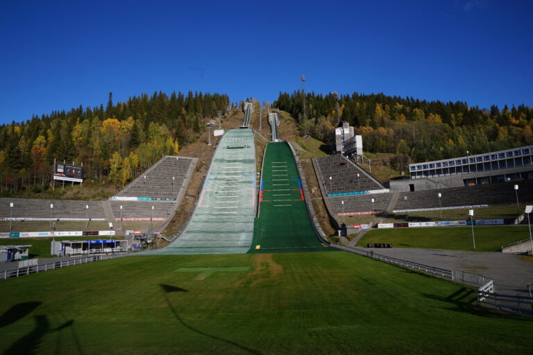 Ski jump stadium in Norway with forest backdrop