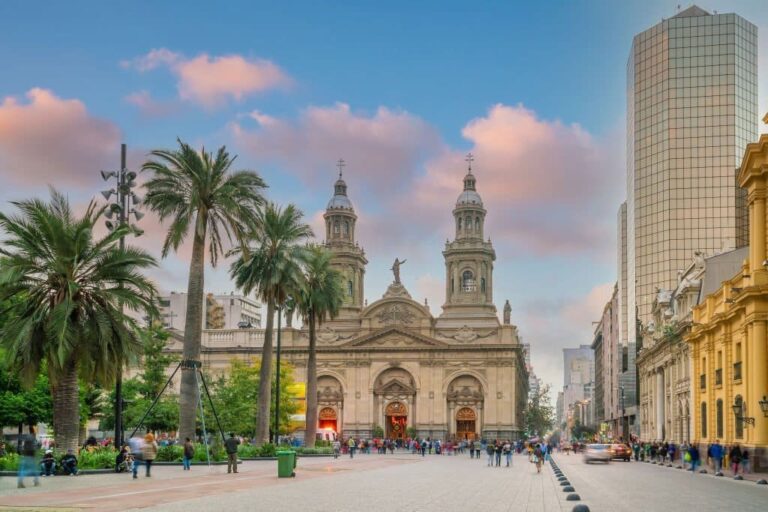 Santiago's Plaza de Armas with cathedral and palm trees