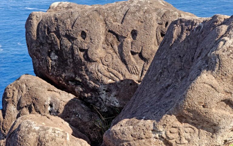 Ancient petroglyphs on rocks at Rano Kau, Easter Island.