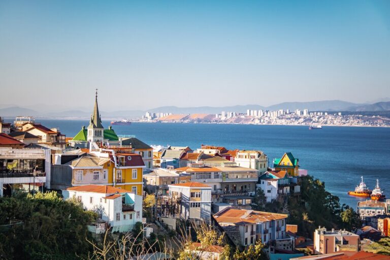 View of colorful buildings in Valparaíso, Chile by the ocean.