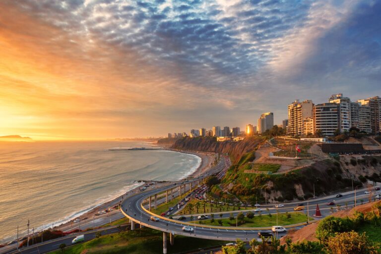 Sunset view of Miraflores district coastline in Lima, Peru.