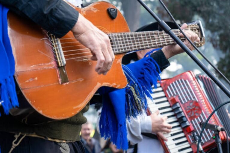 Musicians playing guitar and accordion in traditional attire