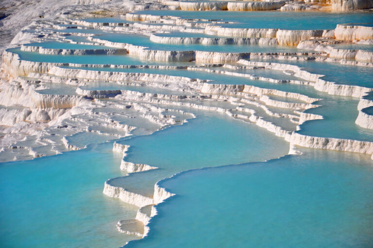 Aerial view of Pamukkale's travertine terraces and thermal pools.