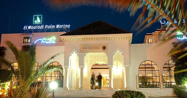 Entrance of El Mouradi Palm Marina Hotel at night